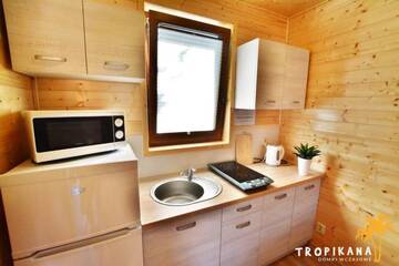 Фото номера Апартаменты с 2 спальнями Лоджи Tropikana Domki, Apartamenty г. Мельно 14