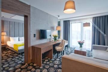 Фото номера Улучшенный семейный номер Отель Baltin Hotel &amp; SPA **** г. Мельно 2