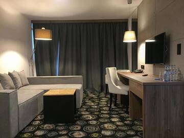 Фото номера Улучшенный семейный номер Отель Baltin Hotel &amp; SPA **** г. Мельно 6