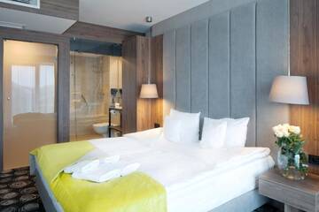 Фото номера Улучшенный семейный номер Отель Baltin Hotel &amp; SPA **** г. Мельно 3