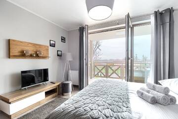 Фото номера Номер-студио с видом на озеро Апартаменты Mielno Apartments Rezydencja Park г. Мельно 3