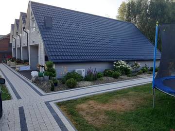 Фото номера Дом с 2 спальнями Дома для отпуска U Wikinga - Domki letniskowe w Mielnie г. Мельно 8